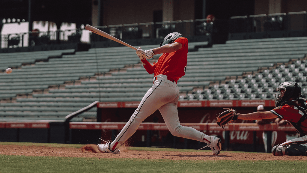 Baseball player hitting the ball during a game